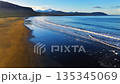 Cinematic Sunrise over Black Sand Volcanic Beach with Crashing Waves, Serene and Tranquil Landscape. Iceland. 135345069