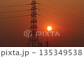 High voltage power transmission tower at sunrise  135349538