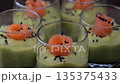 Smoked salmon shot glasses guacamole served with homemade crackers 135375433