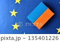 Cargo containers on the EU flag as a conceptual backdrop. Cargo containers on the EU flag 135401226