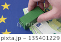 Cargo containers on the EU flag as a conceptual backdrop. Cargo containers on the EU flag 135401229