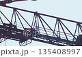 Closeup Of Crane Trolley Moving On Jib. Industrial Machinery Detail In Motion. 135408997