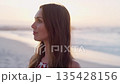 Woman, freedom and peace with view of beach, travel and outdoor mockup with ocean waves, content and sunset calm. Nature, zen and positive energy with adventure, mindfulness and wellness with sea air 135428156