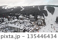 Travel and winter adventure concept. Aerial view of the ski resort. Kopaonik National Park, winter landscape in the mountains, coniferous forest covered with snow 135446434