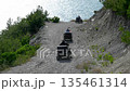 23 August 2025, Russia, Novorossiysk. ATV riders drive along a dirt road by the sea enjoying adventure and scenic coastal views under clear skies 135461314