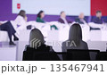 Participants diligently record important speech highlights, Observers carefully document 135467941