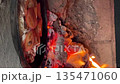 cooking pizza in a russian stove next to coals and burning firewood. cooking food in a vintage stove. vertical video. cooking pizza in a russian stove next to coals and burning firewood. cooking food in a vintage stove. vertical video. 135471060