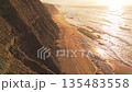 Magoito Beach and Sheer Cliffs at Sunset. Atlantic Ocean, Portugal. Aerial View 135483558