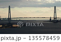 名古屋港ポートビルから見た夕方の名港トリトンの橋とたくさんの車の風景 135578459