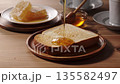 Drizzle honey on toast 135582497