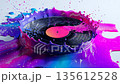 Glossy vinyl record melts into a pool of bright neon colors on a smooth surface 135612528