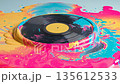 Glossy vinyl record melts into a pool of neon colors in a creative art display 135612533