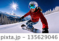 Female Snowboarder descends sunlit slope: thrilling winter adventure in mountain landscape 135629046