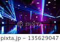 Vibrant nightclub dance floor with colorful laser lights and disco ball reflection 135629047