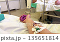 Donor's arm undergoing plasmapheresis procedure with needle and tubing 135651814