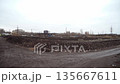 An organic waste treatment plant operating The Industrial Conveyor System Aerator processes organic waste using steam rising inside the waste treatment plant. General plan and scale of organic waste 135667611