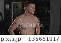 Athlete prepares for training at gym focusing on strength and performance Athlete prepares for training at gym focusing on strength and performance 135681917