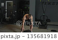 Fitness training session in gym with athlete focused on strength and performance improvement Fitness training session in gym with athlete focused on strength and performance improvement 135681918