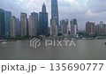 Aerial shot of the modern Shanghai skyline with numerous skyscrapers, corporate towers, and boats 135690777