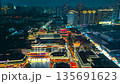 Aerial night illumination of traditional Chinese architecture within the Yuyuan Bazaar complex 135691623