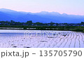 Azumino City, Nagano Prefecture: The Northern Alps and Mount Ariake at sunset, with a beautiful reflection in the rice paddies 135705790