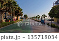 Dubai, UAE, 6.05.2025. Walking along Kite Beach promenade with a jogging track and pedestrian walkway, beachfront restaurants and food kiosks at sunset, popular Dubai beach location for vacation 135718034