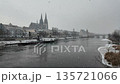 Winter snow falling over Danube River cathedral and stone bridge in Regensburg Germany 135721066