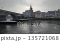 Winter snow falling over Danube River cathedral and stone bridge in Regensburg Germany 135721068