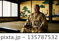 A portrait of Tokugawa Ieyasu sitting on a tatami mat with a gorgeous gold and silver screen painting in the background 135787532