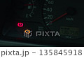 Realtime footage capturing dashboard illuminated symbols indicating vehicle system alerts and concerns 135845918