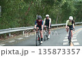 young asian people cycling outdoor on rural road 135873357