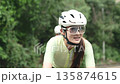 young asian cyclists training on rural road 135874615