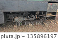 Matheran, Maharashtra, India Close-up view of a narrow-gauge train undercarriage resting on tracks, showing mechanical details of heritage rail transport in the hills. 135896197
