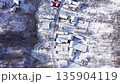 Aerial view of mountain village houses buried under snow. Transylvania, Romania 135904119