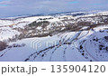 Aerial view of mountain village houses buried under snow. Transylvania, Romania 135904120