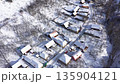 Aerial view of mountain village houses buried under snow. Transylvania, Romania 135904121