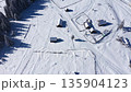 Aerial view of snow covered remote mountain homestead in Transylvania, Romania 135904123