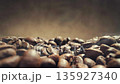 Freshly roasted coffee beans with smoke close-up, slow motion 135927340