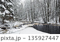 Lindulovskaya grove, an ecological trail, a calm winding river in a snowy forest, trees under the snow in the forest, peace and quiet, reflection on the water, without people 135927447