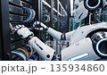A humanoid robot performing maintenance on a data center server while it is running at full capacity. 135934860