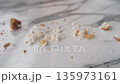 Crumbs scattered on a marble counter after a meal in a cafe 135973161