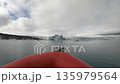 Boat trip cruise among melting icebergs as result of global warming. Jokulsarlon, Iceland 135979564