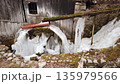 Frozen water mill with frozen water ice at winter in a village 135979566