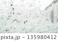 snow pattern on window glass 135980412