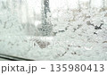 snow pattern on window glass 135980413