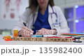 Wooden cubes spell phrase Targeted Therapy on clinical desk 135982400