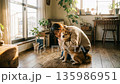 A young woman hugging her beloved Shiba Inu in a sunny living room A young woman hugging her beloved Shiba Inu in a sunny living room 135986951