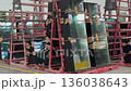 Large sheets of safety glass stacked on factory rack. Industrial storage solutions for production of windows and building materials. 136038643