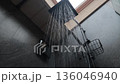 Water running from black shower head, modern bathroom interior with droplets 136046940