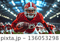 A man in a red uniform holding a football on a field 136053298
